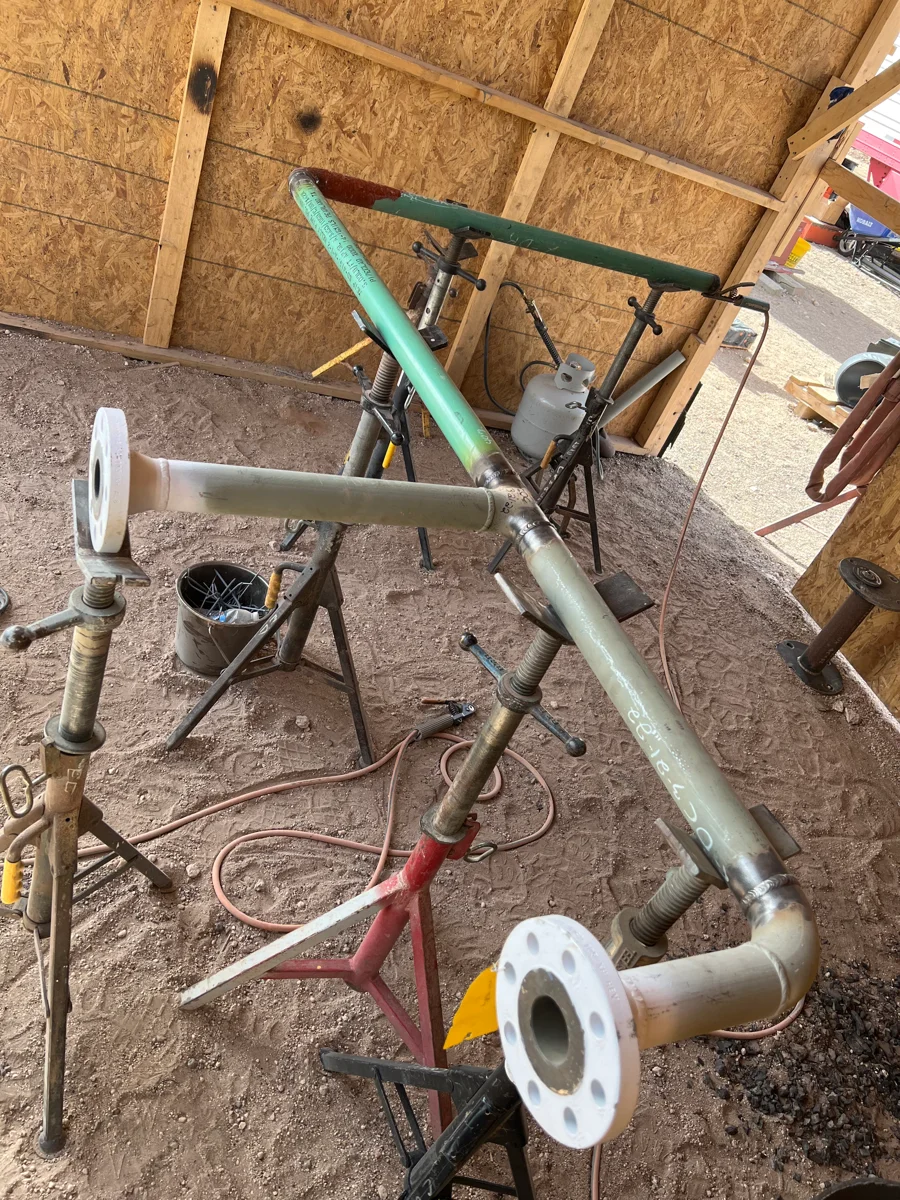 Fabricated pipe assembly supported on stands