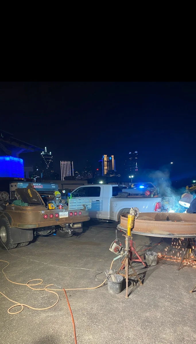 Welding work underway outdoors at night