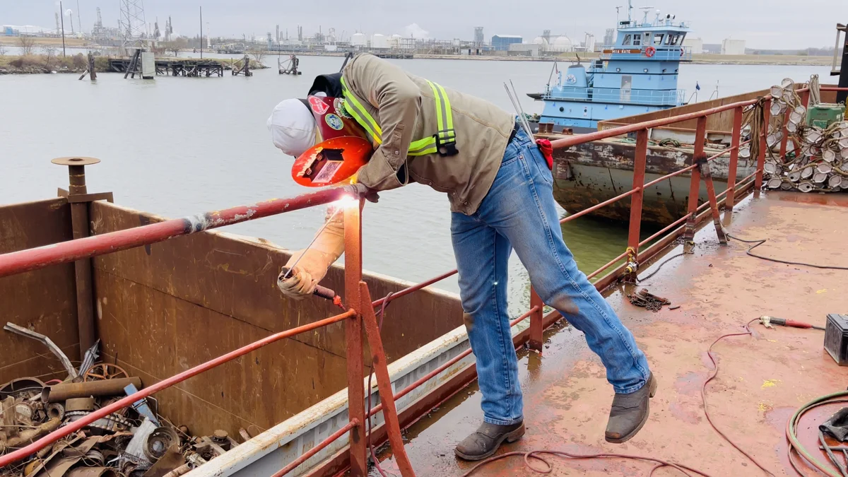 Metalwork being performed on an outdoor railing